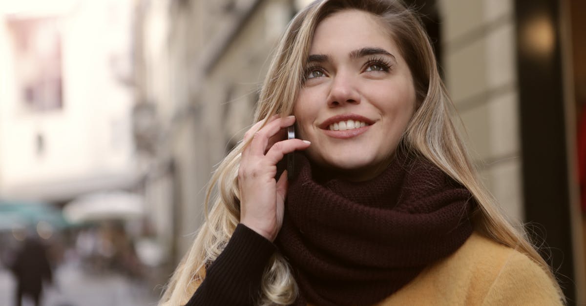 Is speaking Portuguese useful in Macau today? - Woman in Coffee Brown Coat Looking Up The Sky Is speaking Portuguese useful in Macau today? - Woman in Coffee Brown Coat Looking Up The Sky