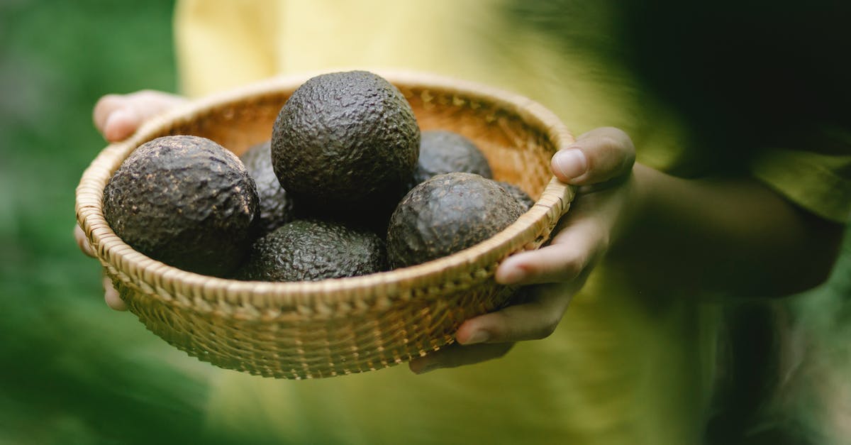 Is Sweden full of mosquitoes during the summer? - Crop faceless female holding wicker bowl full of avocado while standing in garden Is Sweden full of mosquitoes during the summer? - Crop faceless female holding wicker bowl full of avocado while standing in garden