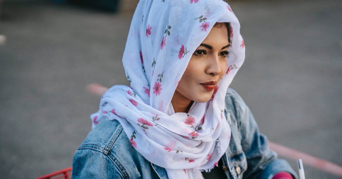 Is taking laundry powder across national borders likely to cause problems? [duplicate] - Young Muslim female in headscarf and jeans jacket thinking while drinking coffee and writing notes