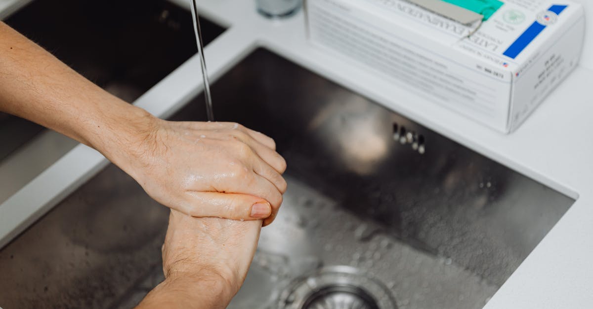 Is tap water in Ireland and England drinkable? - Persons Left Hand on Black Table Is tap water in Ireland and England drinkable? - Persons Left Hand on Black Table