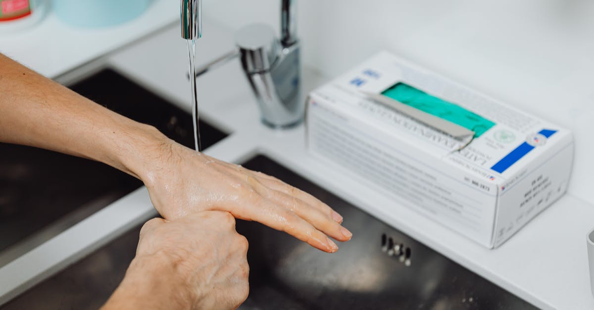 Is tap water in Ireland and England drinkable? - Doctor Washing Hands under Tap Water Is tap water in Ireland and England drinkable? - Doctor Washing Hands under Tap Water