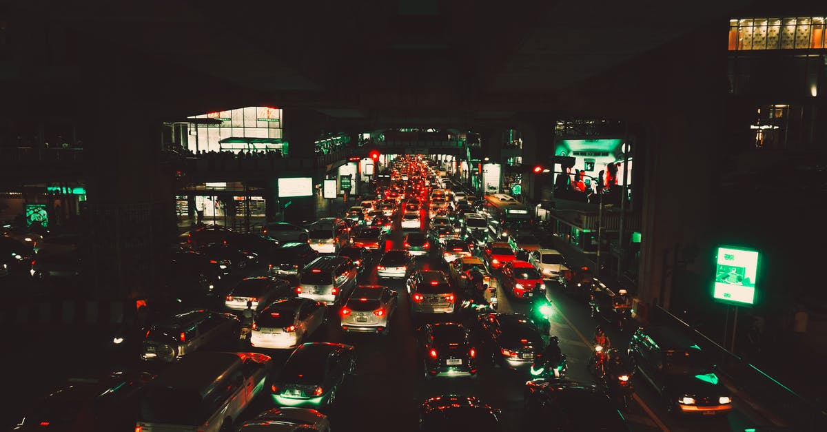 Is the Cairo - Cape Town Highway passable? - Car Passing Through Road Beside Building Is the Cairo - Cape Town Highway passable? - Car Passing Through Road Beside Building