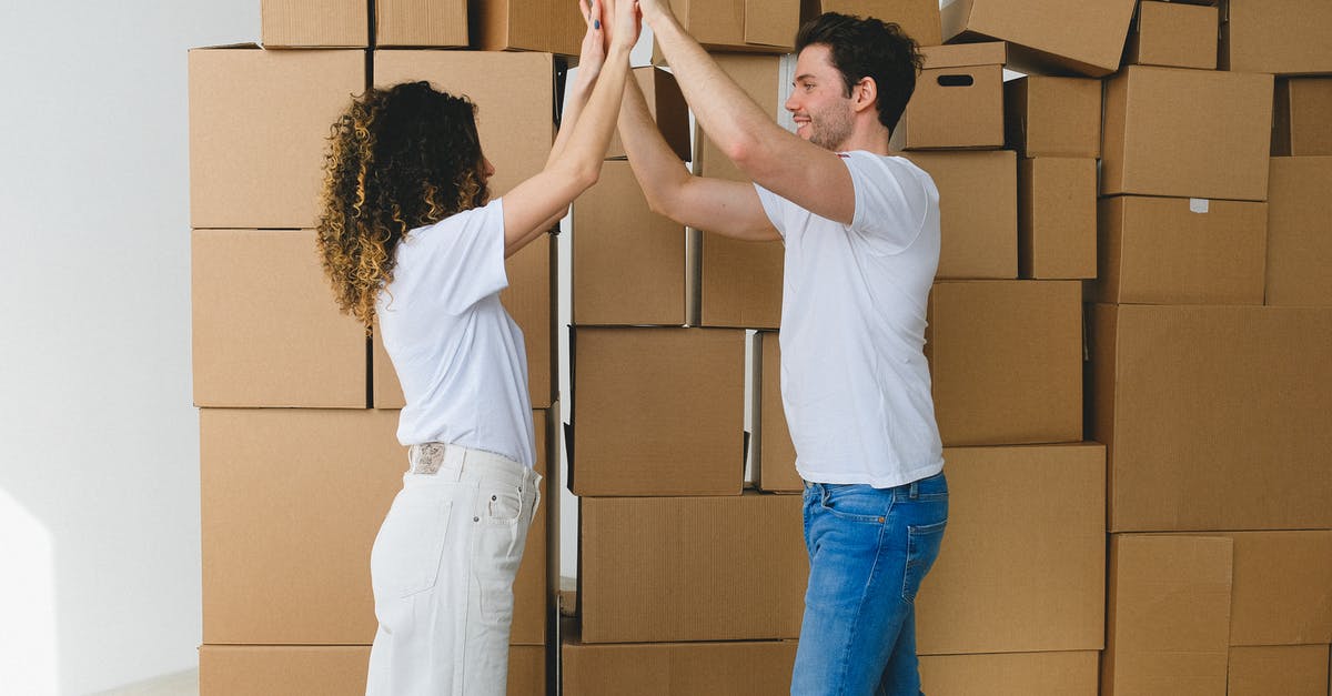Is the NYC CityPASS a good deal? - Smiling couple giving high five after moving into new house Is the NYC CityPASS a good deal? - Smiling couple giving high five after moving into new house