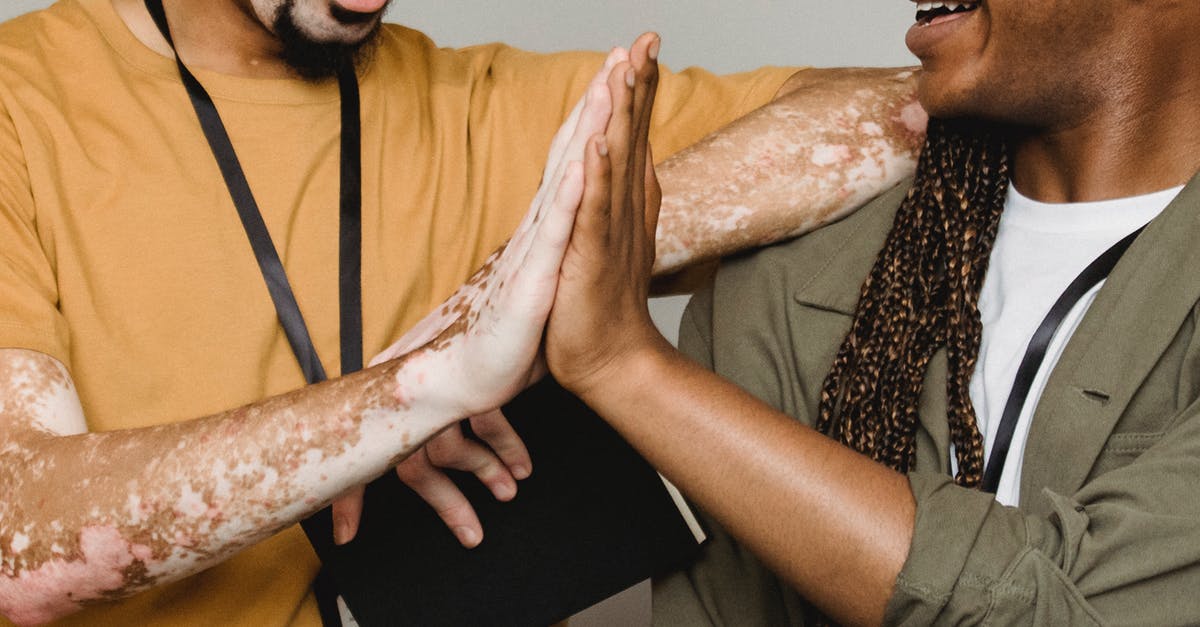 Is the NYC CityPASS a good deal? - Crop smiling African American male with vitiligo skin giving high five to colleague in studio Is the NYC CityPASS a good deal? - Crop smiling African American male with vitiligo skin giving high five to colleague in studio