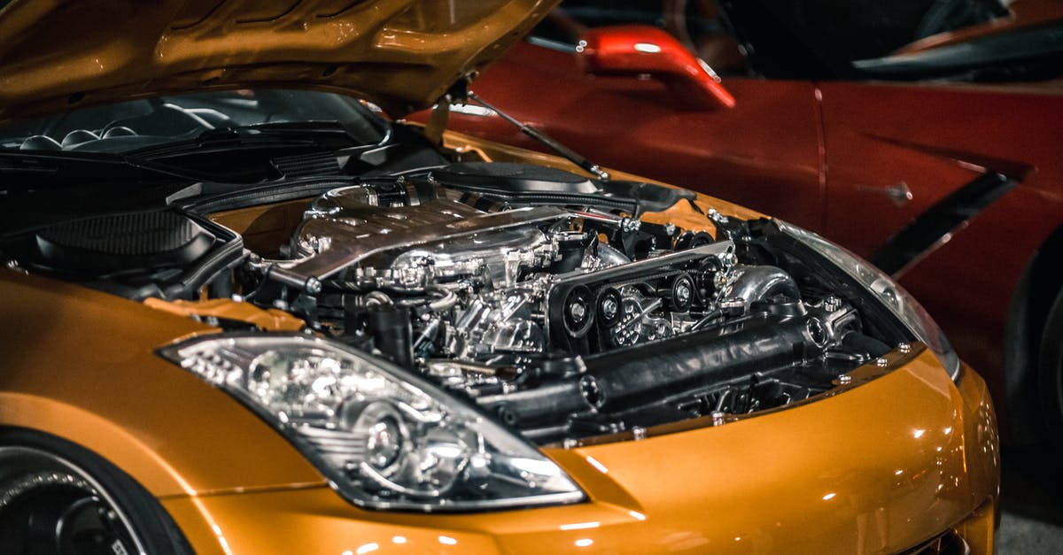 Is the Polish railway system very fragmented? - From above of modern shiny polished engine with details under hood of expensive car parked at parking lot Is the Polish railway system very fragmented? - From above of modern shiny polished engine with details under hood of expensive car parked at parking lot