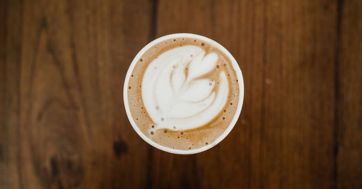 Is the Sudbury Slag Pour still a thing? - Top view of cup of aromatic cappuccino in ceramic cup with white foam poured in form of plant on brown surface Is the Sudbury Slag Pour still a thing? - Top view of cup of aromatic cappuccino in ceramic cup with white foam poured in form of plant on brown surface
