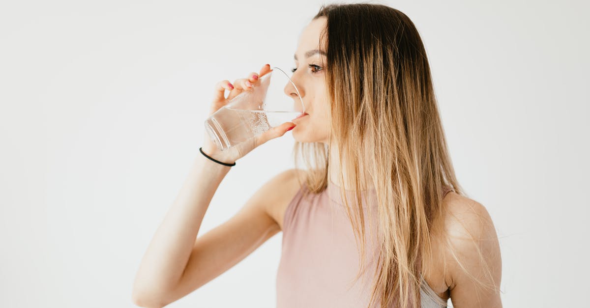 Is the tapwater fit to drink throughout Taiwan? - Young thirsty fit female with long hair in sportswear drinking water while recreating after workout Is the tapwater fit to drink throughout Taiwan? - Young thirsty fit female with long hair in sportswear drinking water while recreating after workout