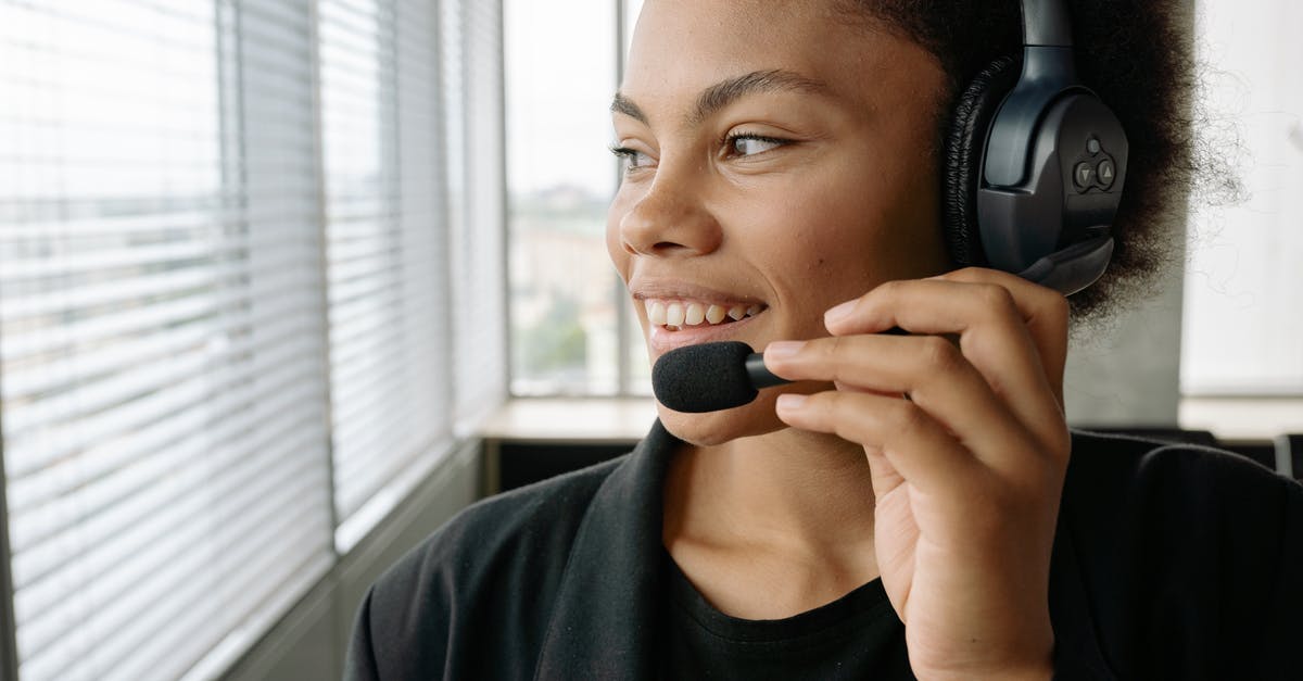 Is the tour operator with the website en.arcticexpedition.ru still operating? [closed] - Close-Up Photo of a Woman with Curly Hair Holding the Microphone of Her Headset