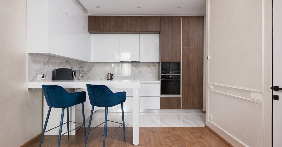 Is the transit area of Ataturk/Istanbul airport open early in the morning? - Interior of modern kitchen with comfortable chairs placed near table cabinets and appliances Is the transit area of Ataturk/Istanbul airport open early in the morning? - Interior of modern kitchen with comfortable chairs placed near table cabinets and appliances