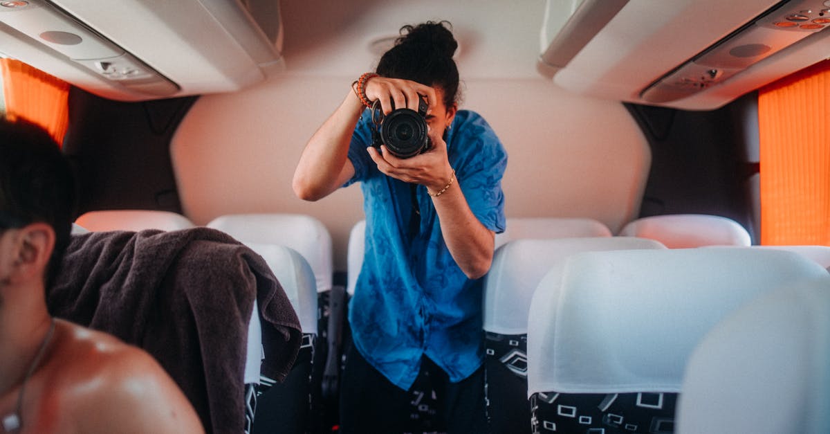 Is there a bus pass for Eastern Canada? - Woman in Blue Shirt Holding Black Camera Is there a bus pass for Eastern Canada? - Woman in Blue Shirt Holding Black Camera