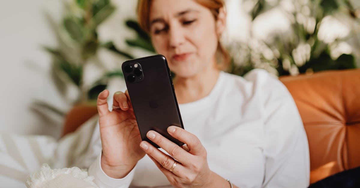 Is there a Canadian equivalent to Mobile Passport? - Woman in White Dress Shirt Holding Black Iphone 7 Plus Is there a Canadian equivalent to Mobile Passport? - Woman in White Dress Shirt Holding Black Iphone 7 Plus