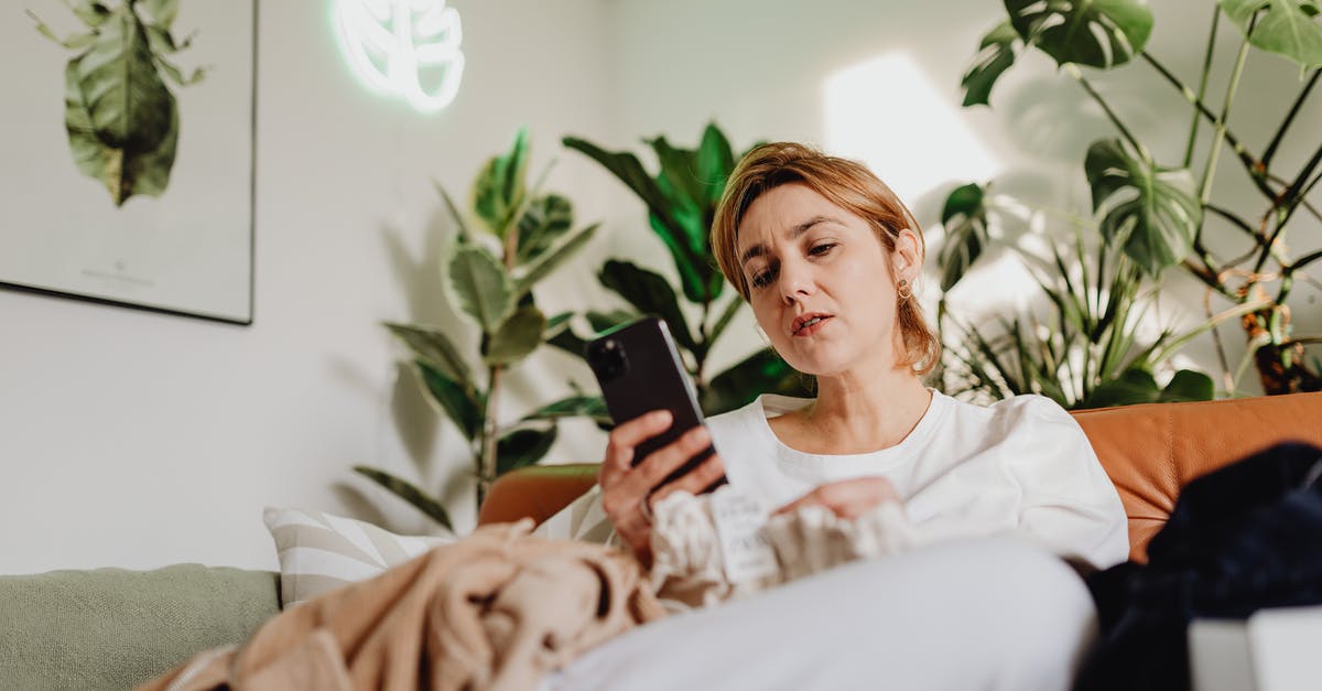 Is there a Canadian equivalent to Mobile Passport? - Woman Sitting on a Couch and Using a Phone Is there a Canadian equivalent to Mobile Passport? - Woman Sitting on a Couch and Using a Phone