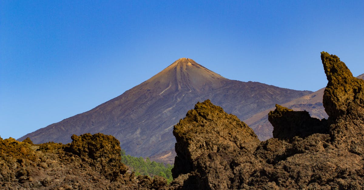 Is there a charge for mountain rescue in Spain (Canary Islands)? - Brown Mountain Under Blue Sky