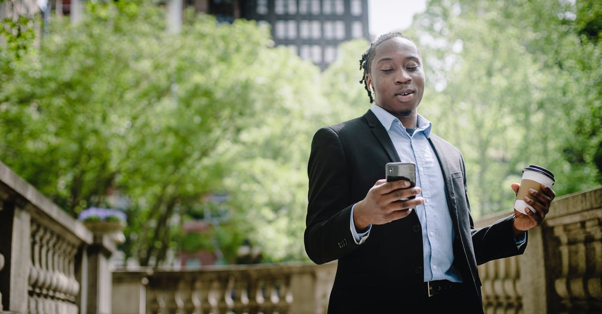 Is there a good and objective resource online about Zika virus? - Positive young black man with smartphone and takeaway coffee in city park Is there a good and objective resource online about Zika virus? - Positive young black man with smartphone and takeaway coffee in city park