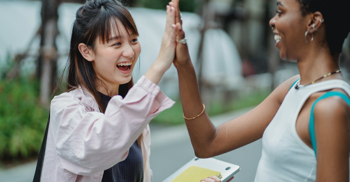 Is there a guarantee that flightfox.com will be cheaper than other booking methods? - Side view excited multiracial female students in casual clothes giving high five to each other while spending break in lush park Is there a guarantee that flightfox.com will be cheaper than other booking methods? - Side view excited multiracial female students in casual clothes giving high five to each other while spending break in lush park