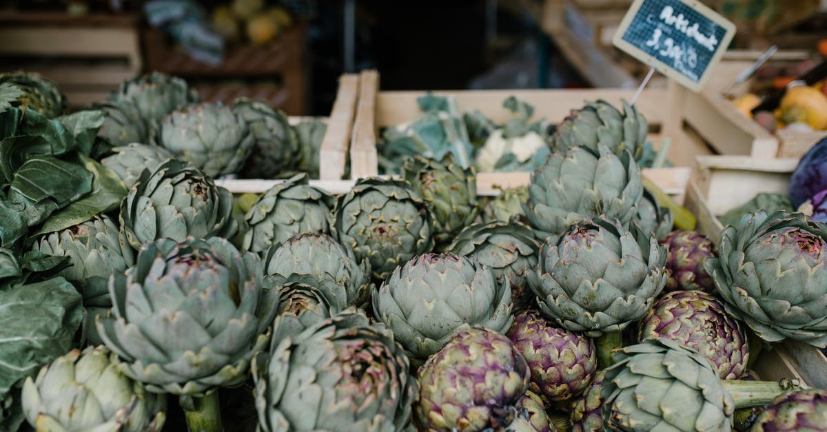 Is there a hawker stall selling local food in walking distance from Changi airport? - Ripe artichokes in boxes in market Is there a hawker stall selling local food in walking distance from Changi airport? - Ripe artichokes in boxes in market