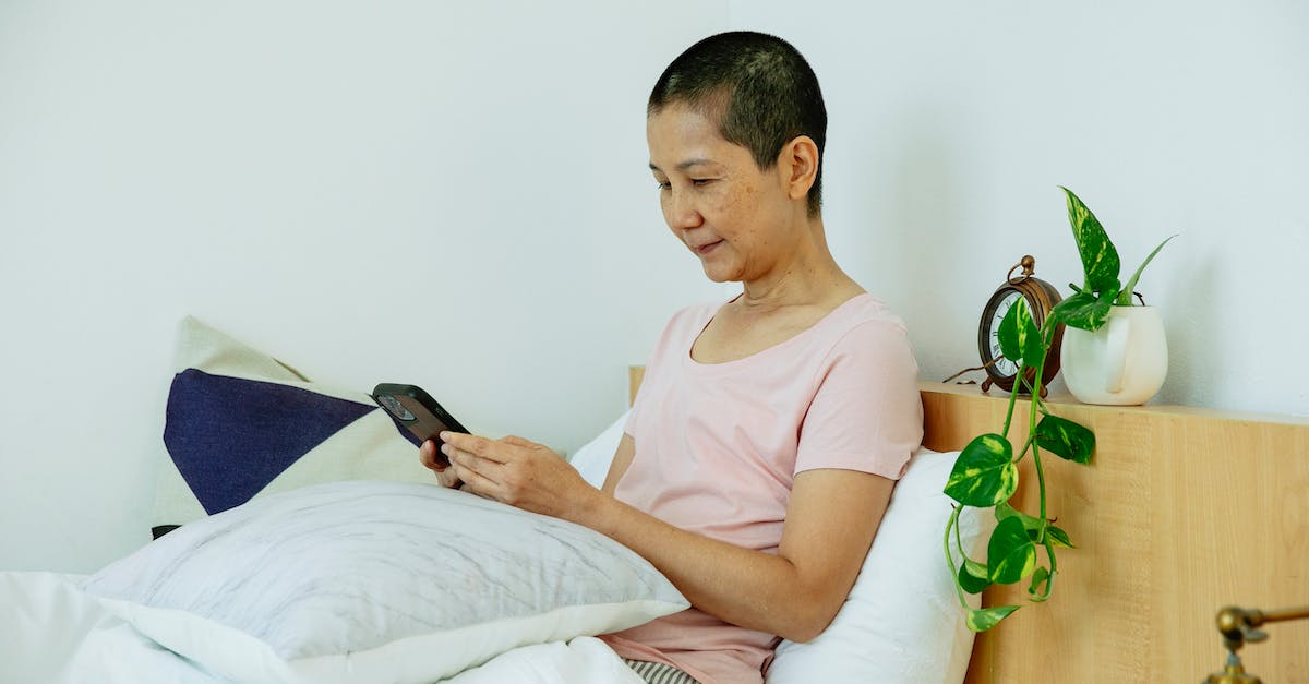 Is there a hotel / B&B Finder using Google or Bing maps? - Ethnic mature woman in pajama sitting in bed under blanket with pillows while using smartphone in bright bedroom near potted plant Is there a hotel / B&B Finder using Google or Bing maps? - Ethnic mature woman in pajama sitting in bed under blanket with pillows while using smartphone in bright bedroom near potted plant