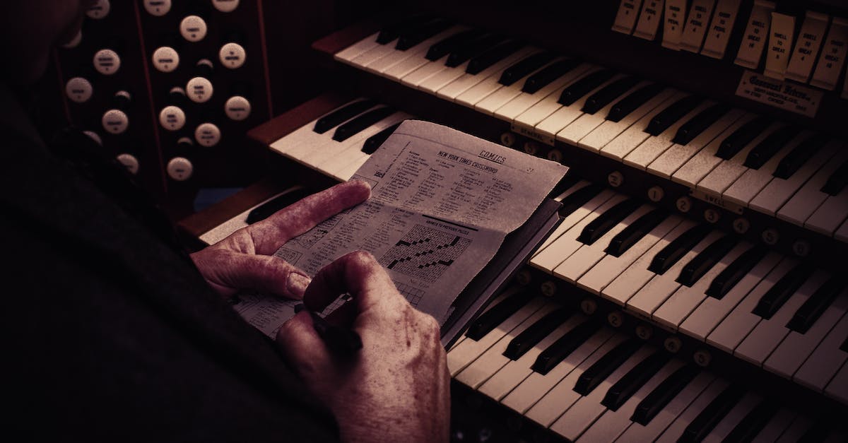 Is there a hotel in Paris with a grand piano "en suite"? - Person Playing Piano With White Paper on Top Is there a hotel in Paris with a grand piano "en suite"? - Person Playing Piano With White Paper on Top