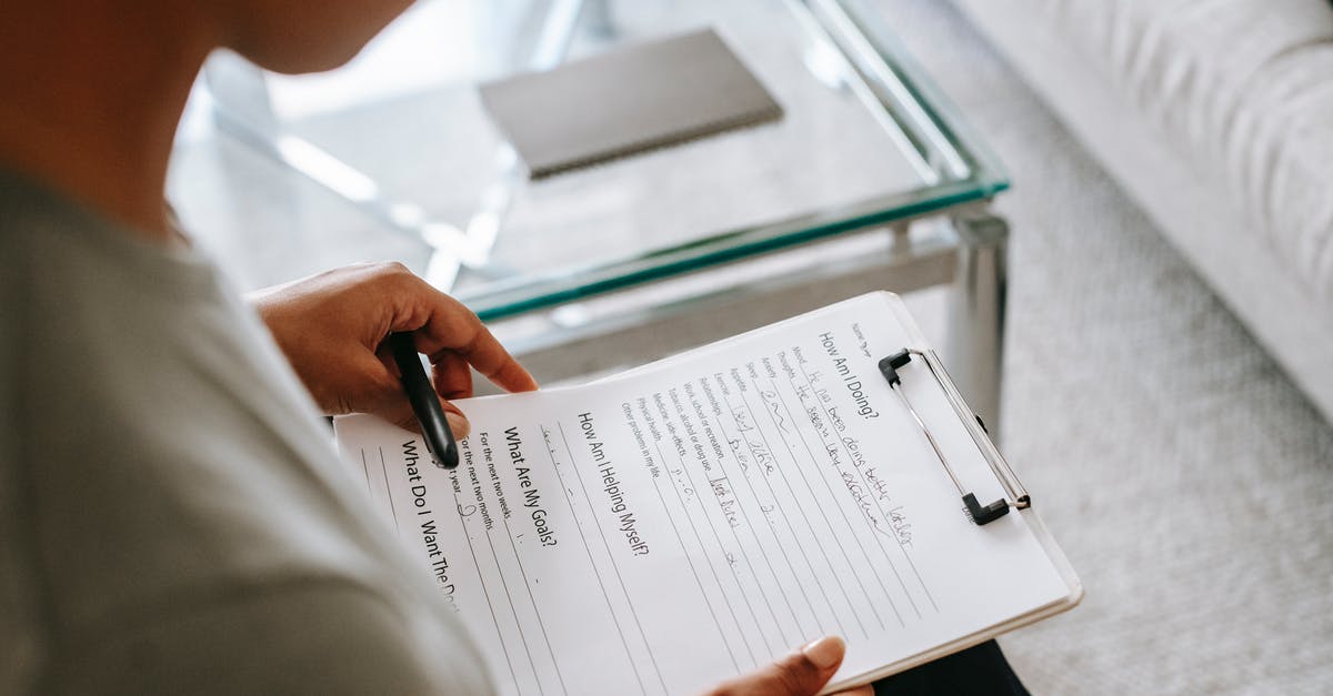 Is there a known problem with ESTA form online?passport validity? [duplicate] - From above of blurred anonymous female psychologist reading documents on clipboard while sitting in office near table during session