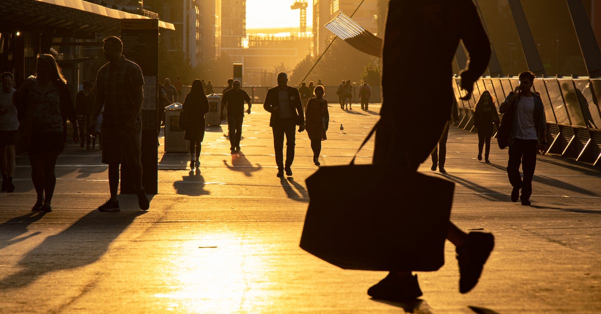 Is there a need for ESTA visa update when traveling to different location? [duplicate] - People on crowded wide busy street in downtown walking along in city in evening