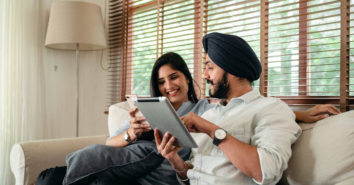 Is there a possibility to preserve an unused Indian mobile number for a period of time? - Optimistic young Indian couple using tablet and smartphone during weekend Is there a possibility to preserve an unused Indian mobile number for a period of time? - Optimistic young Indian couple using tablet and smartphone during weekend