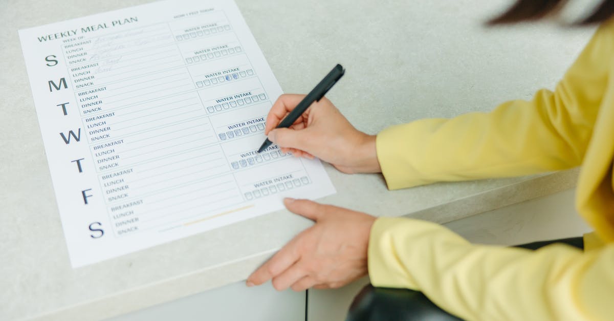 Is there a prepaid SIM for 2 weeks in Germany? [duplicate] - A Person Holding a Black Pen Writing on White Paper