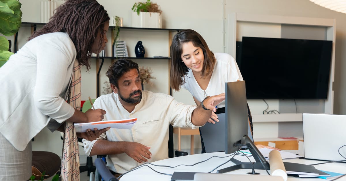 Is there a rental agency for Citroen 2CVs, Meharis or Renault R4s in Corsica? - Photograph of a Man Showing Something on the Monitor to His Coworkers Is there a rental agency for Citroen 2CVs, Meharis or Renault R4s in Corsica? - Photograph of a Man Showing Something on the Monitor to His Coworkers
