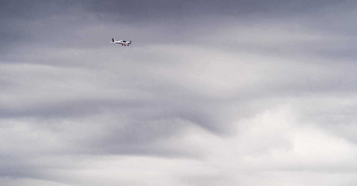 Is there a resource that lists airport taxes? - White Airplane Flying Under Gray Clouds Is there a resource that lists airport taxes? - White Airplane Flying Under Gray Clouds