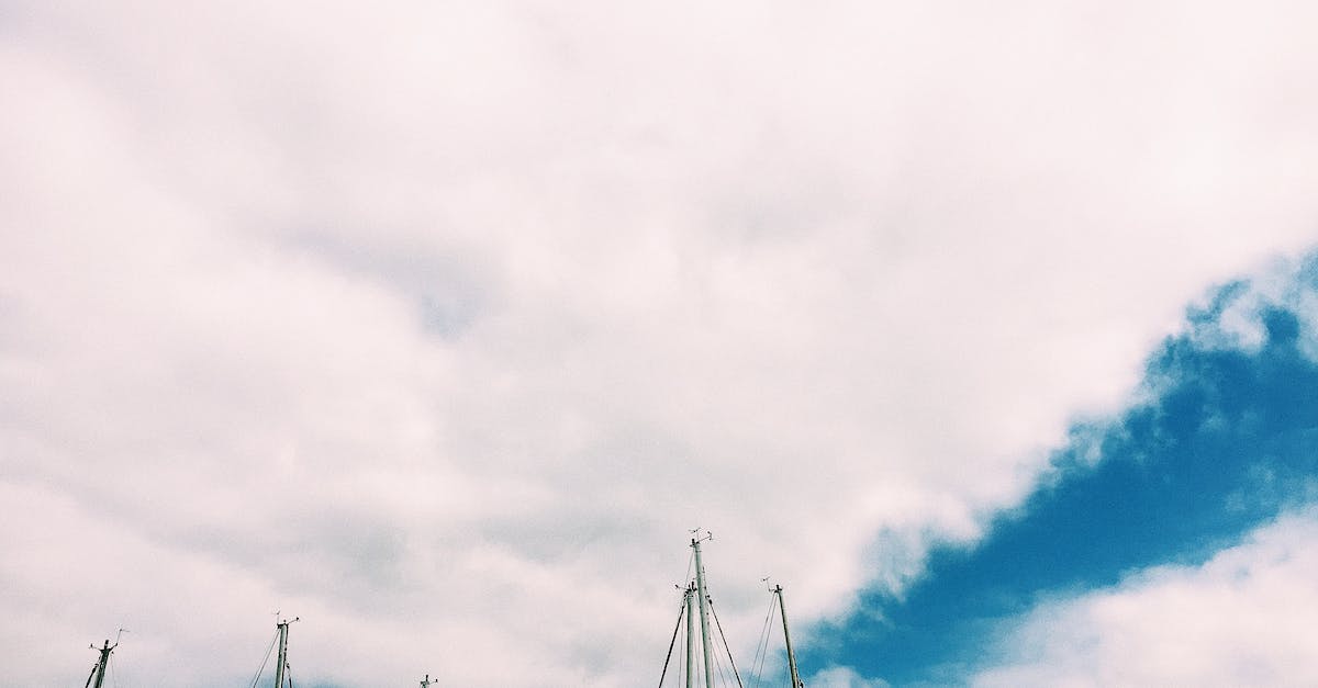 Is there a ship of the line that I can sail on from Britain? - Sailboats with deflated sails under cloudy sky Is there a ship of the line that I can sail on from Britain? - Sailboats with deflated sails under cloudy sky