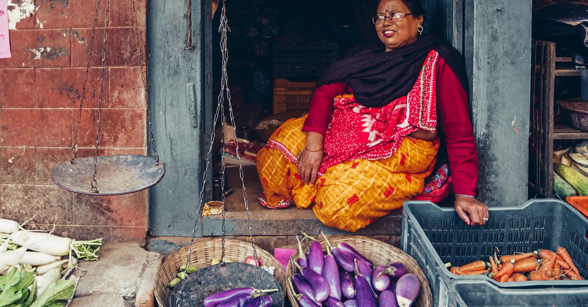 Is there a store selling T-Mobile SIM cards in Houston's IAH International Airport? - Woman in Red and Yellow Sari Sitting on Brown Wooden Chair Is there a store selling T-Mobile SIM cards in Houston's IAH International Airport? - Woman in Red and Yellow Sari Sitting on Brown Wooden Chair