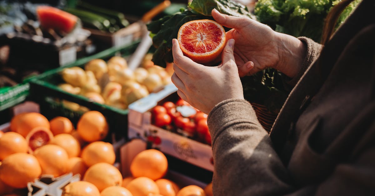 Is there a way to buy food in bulk cheap in Germany? [closed] - A Person Holding Freshly Cut Fruit