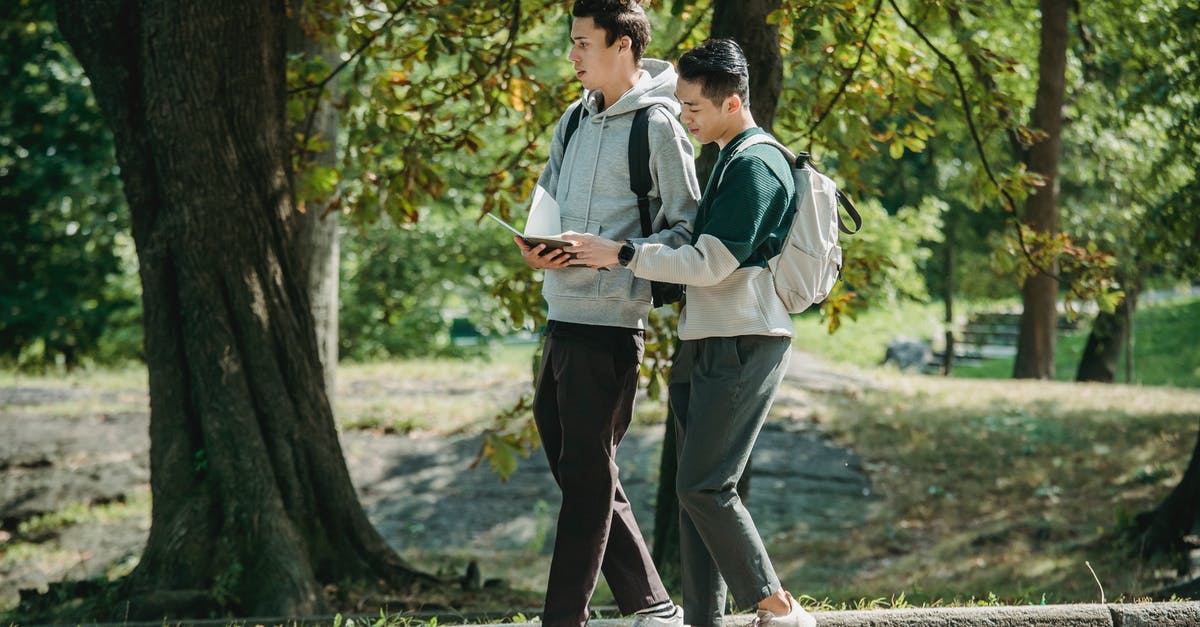 Is there a way to exclude third-party booking websites on Skyscanner? - Side view of young stylish diverse male friends in casual outfits and backpacks walking together in path in park and preparing for exam Is there a way to exclude third-party booking websites on Skyscanner? - Side view of young stylish diverse male friends in casual outfits and backpacks walking together in path in park and preparing for exam