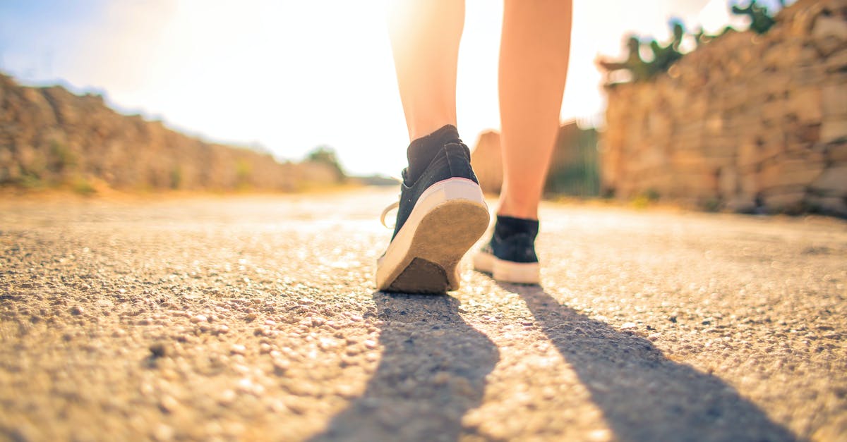 Is there any mandatory medical fitness report required to travel to Finland? - Woman Walking on Pathway Under The Sun Is there any mandatory medical fitness report required to travel to Finland? - Woman Walking on Pathway Under The Sun