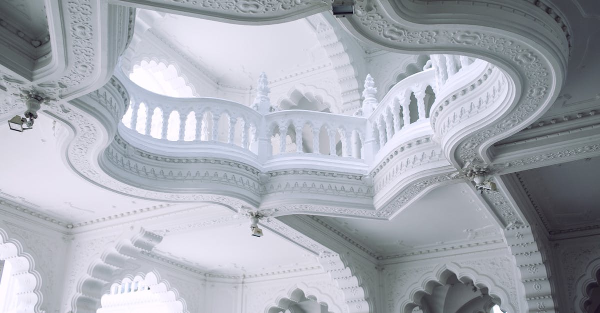 Is there any museum in Europe about Olympics? - From below of old stone building interior with decorative white walls and fenced balcony in sunlight Is there any museum in Europe about Olympics? - From below of old stone building interior with decorative white walls and fenced balcony in sunlight