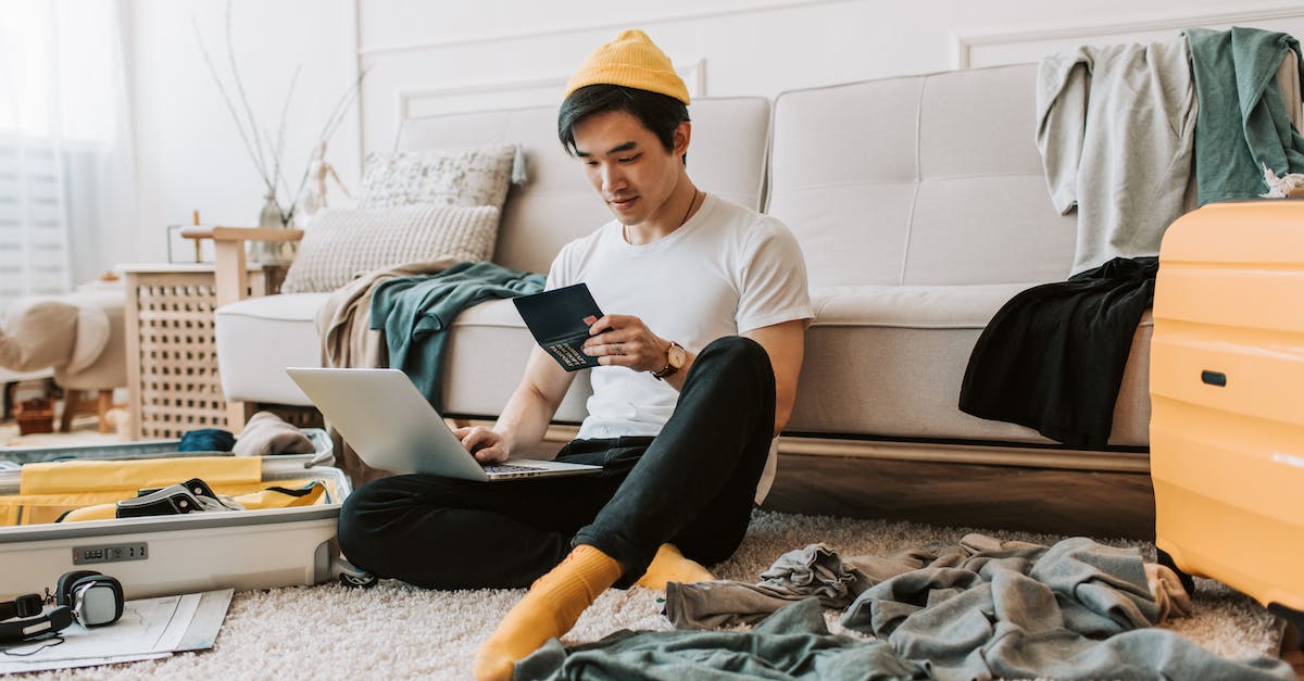 Is there any online resource that can tell me what visa rules are for passport holders of a specific country? - A Man Using His Laptop in a Messy Living Room Is there any online resource that can tell me what visa rules are for passport holders of a specific country? - A Man Using His Laptop in a Messy Living Room