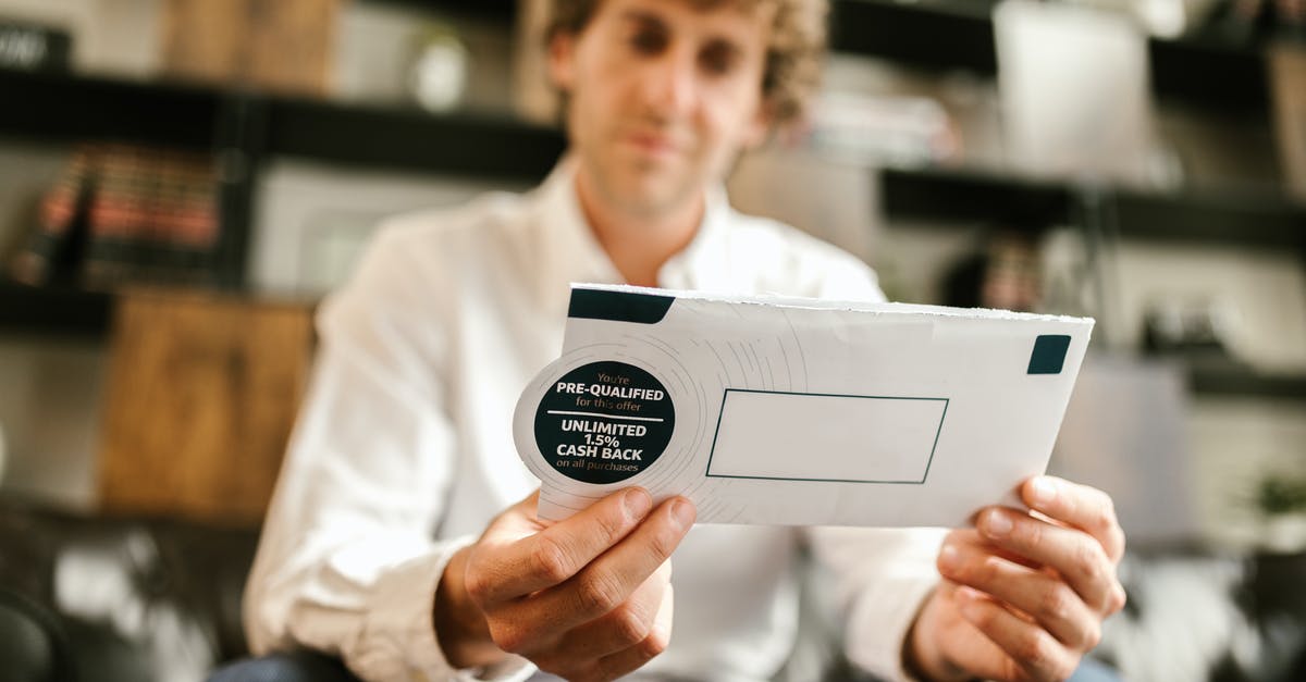 Is there any personal benefit in formally cancelling a (non-refundable) flight? - Man in White Dress Shirt Holding White Envelope