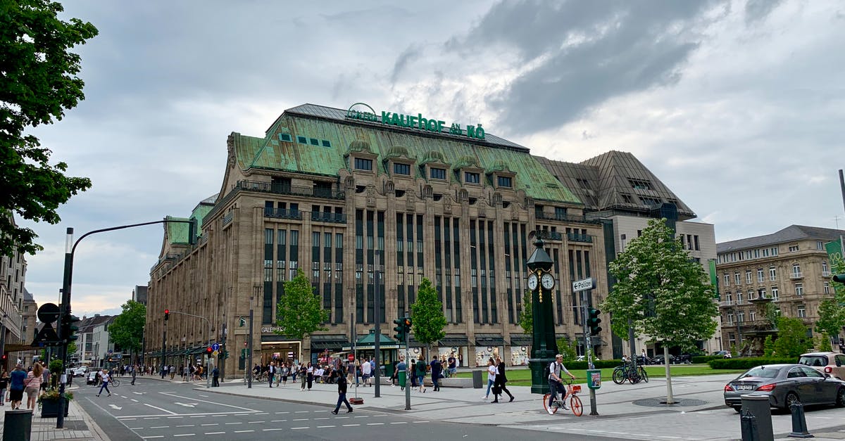 Is there any train from Germany to France where I can bring my car with me? - Old building facade located on city street Is there any train from Germany to France where I can bring my car with me? - Old building facade located on city street