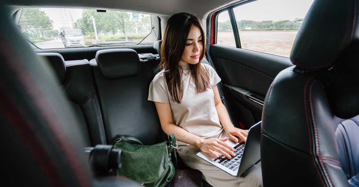 Is there any travel management software / webportal available? - Woman Using Laptop Computer Inside Vehicle Is there any travel management software / webportal available? - Woman Using Laptop Computer Inside Vehicle