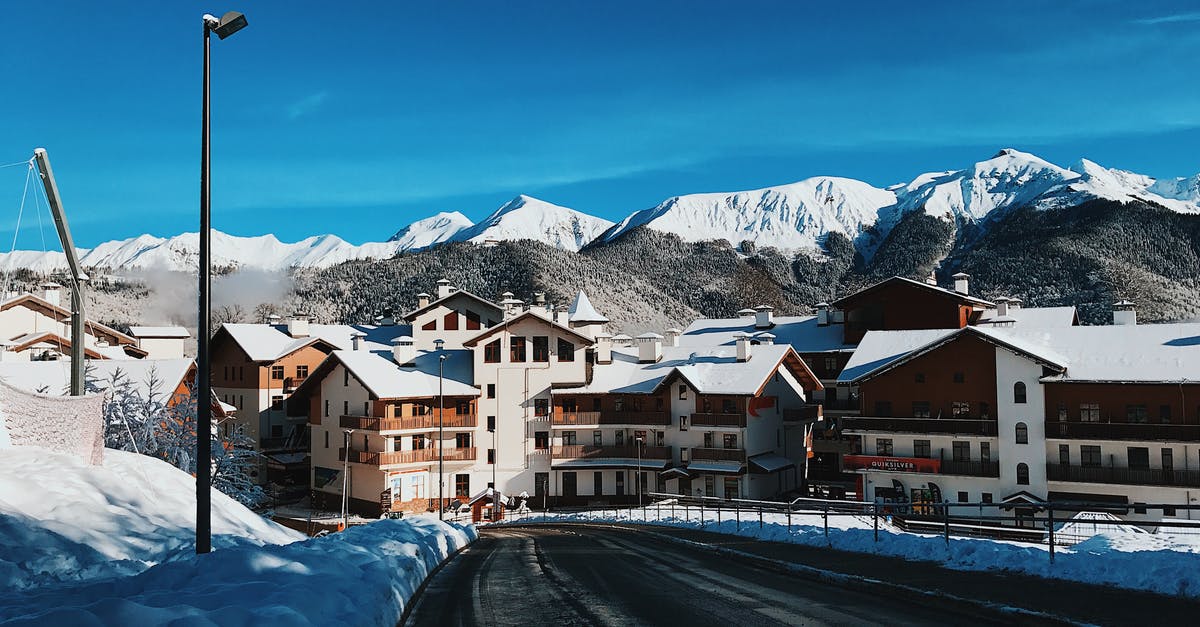Is there snow in Sochi in summer? - White and Brown Buildings Near Snow Covered Mountains Is there snow in Sochi in summer? - White and Brown Buildings Near Snow Covered Mountains