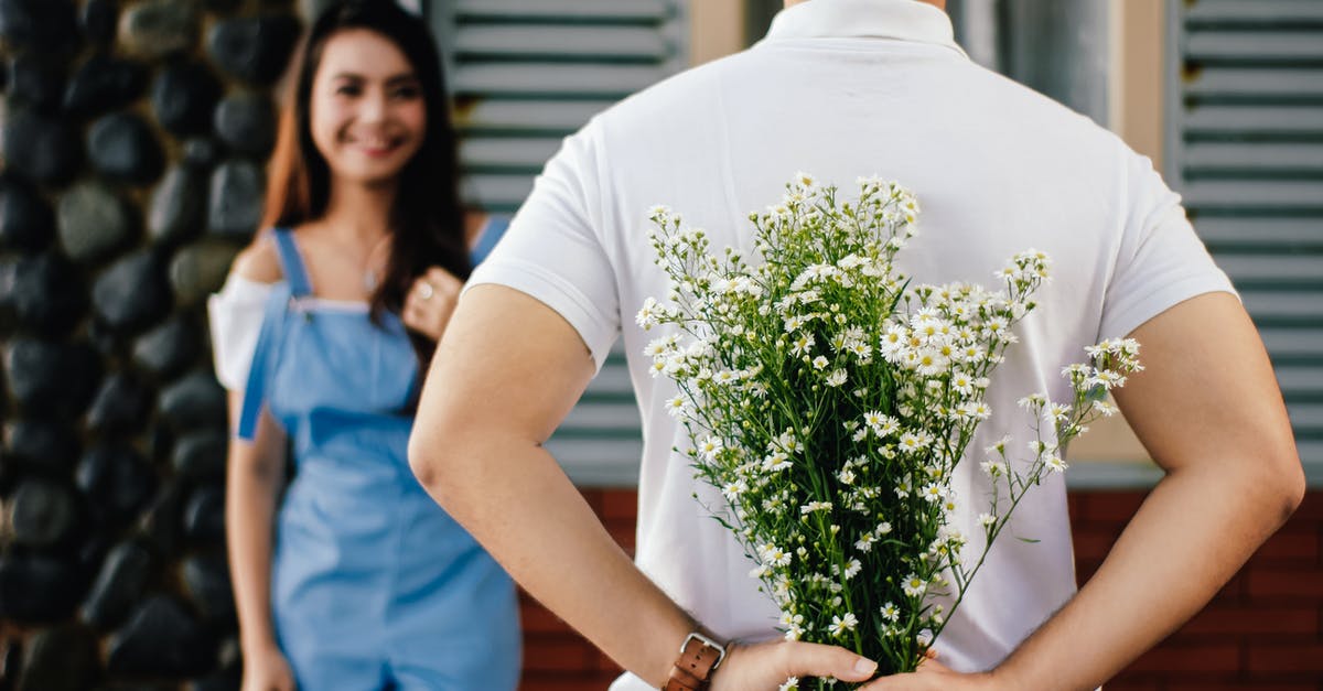 Is this back to back ticketing or throwaway ticketing? - Man Holding Baby's-breath Flower in Front of Woman Standing Near Marble Wall Is this back to back ticketing or throwaway ticketing? - Man Holding Baby's-breath Flower in Front of Woman Standing Near Marble Wall