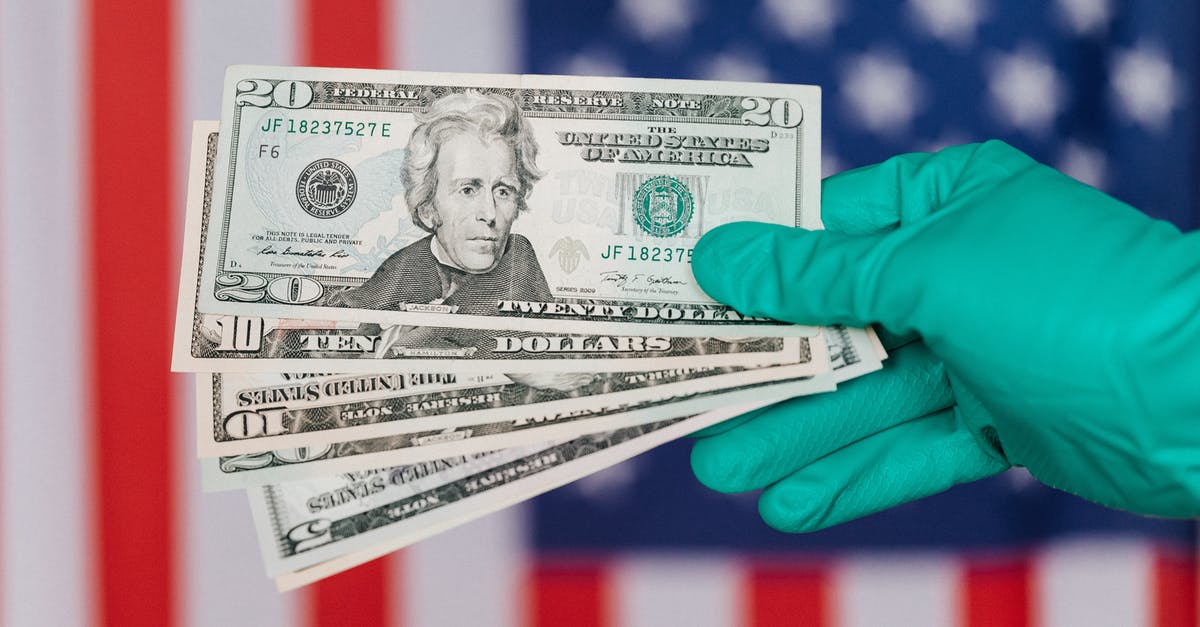 Is this document likely partly sufficient to obtain a USA medical visa? - Banknotes of American dollars in hand against flag