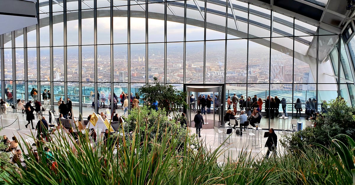 Is tipping customary in London in a restaurant? - People Inside The Sky Garden With View Of Cityscape Is tipping customary in London in a restaurant? - People Inside The Sky Garden With View Of Cityscape