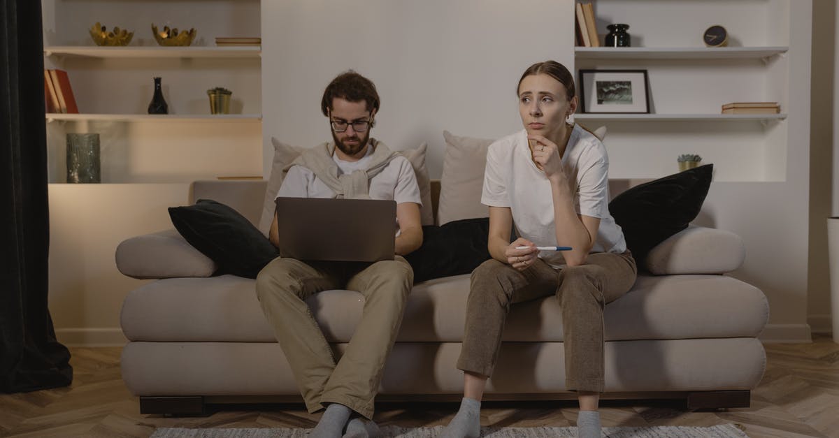 Is tipping expected in Indonesia? - Man and Woman Sitting on Couch Is tipping expected in Indonesia? - Man and Woman Sitting on Couch
