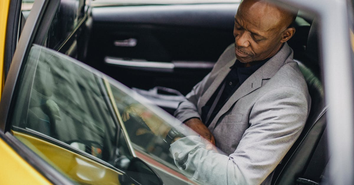 Is TSA Pre-Check's KTN more reliable than Global Entry's? - Side view punctual adult African American businessman in formal clothing sitting in taxi car and checking time on wristwatch Is TSA Pre-Check's KTN more reliable than Global Entry's? - Side view punctual adult African American businessman in formal clothing sitting in taxi car and checking time on wristwatch