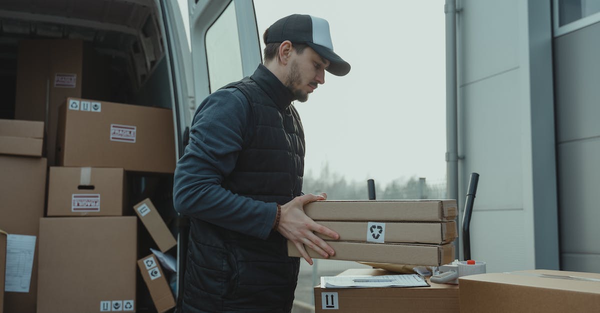Is Van a good base to visit Turkey and Kurdistan? - Man Checking the Paper while Carrying the Packages Is Van a good base to visit Turkey and Kurdistan? - Man Checking the Paper while Carrying the Packages
