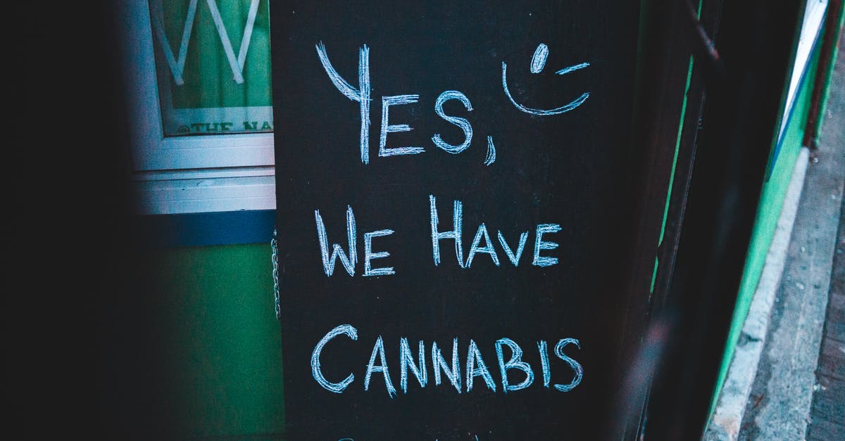 Is weed still legal for tourists in Amsterdam? - Lettering written on black chalkboard with cannabis offer near house on street of city Is weed still legal for tourists in Amsterdam? - Lettering written on black chalkboard with cannabis offer near house on street of city