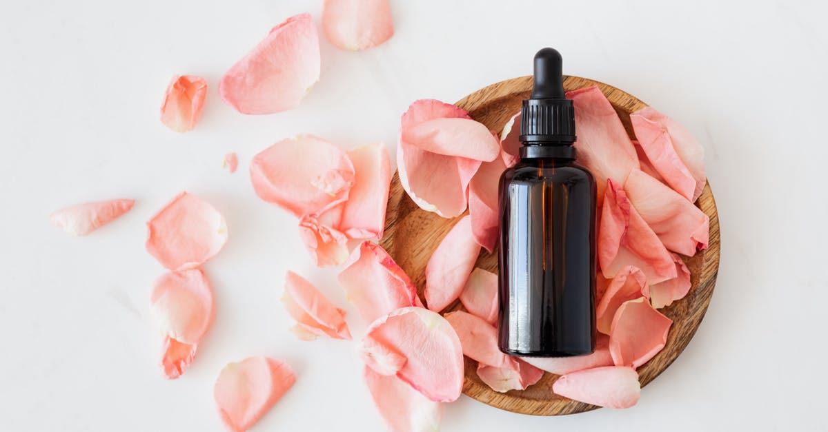 Is whipped cream a liquid for the purposes of airport security? - Top view of empty brown bottle for skin care product placed on wooden plate with fresh pink rose petals on white background isolated Is whipped cream a liquid for the purposes of airport security? - Top view of empty brown bottle for skin care product placed on wooden plate with fresh pink rose petals on white background isolated