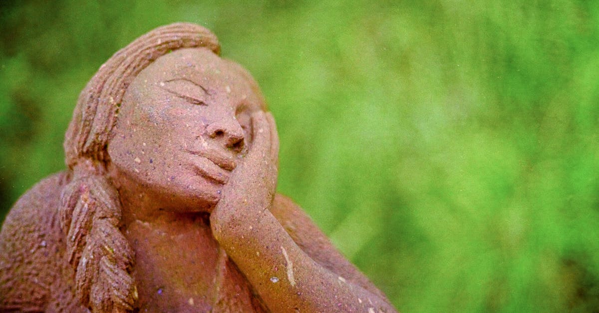 Israel - Identification of Stone statue - Brown Ceramic Angel Figurine on Green Grass Israel - Identification of Stone statue - Brown Ceramic Angel Figurine on Green Grass