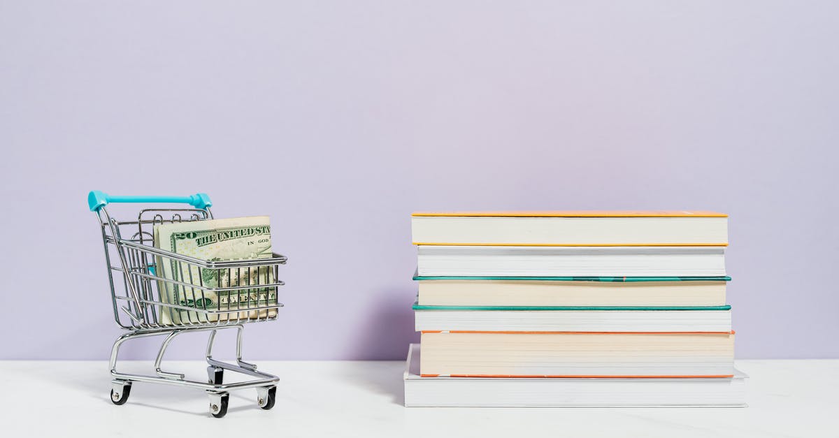 Issue with money order for Canadian visa - Stack of Books Beside A Shopping Cart With Cash Money Issue with money order for Canadian visa - Stack of Books Beside A Shopping Cart With Cash Money