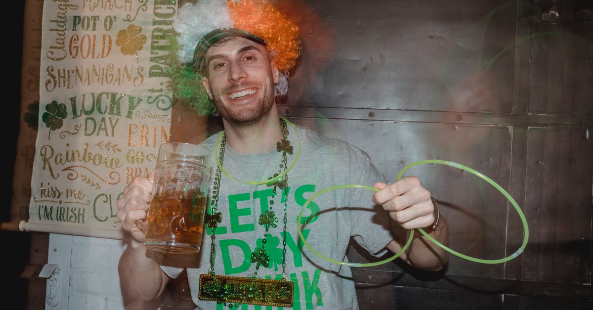 It's allowed to dance (and cultural events) on the Louvre Square? - Laughing guy in clown wig and with neon glow stick necklace on party It's allowed to dance (and cultural events) on the Louvre Square? - Laughing guy in clown wig and with neon glow stick necklace on party
